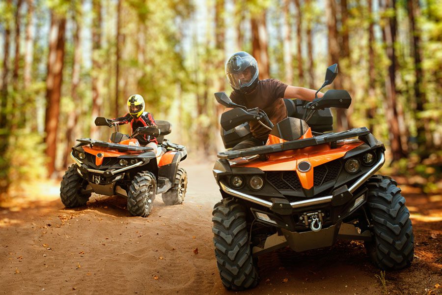 Off-Road Vehicle Insurance - Father and Son Using ATVs